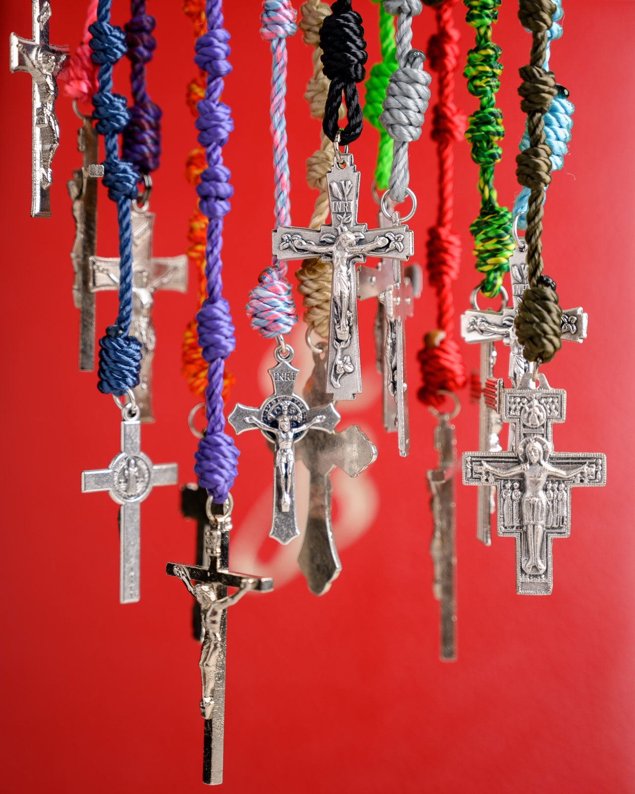 Colorful all-twine knotted Rosaries hanging together